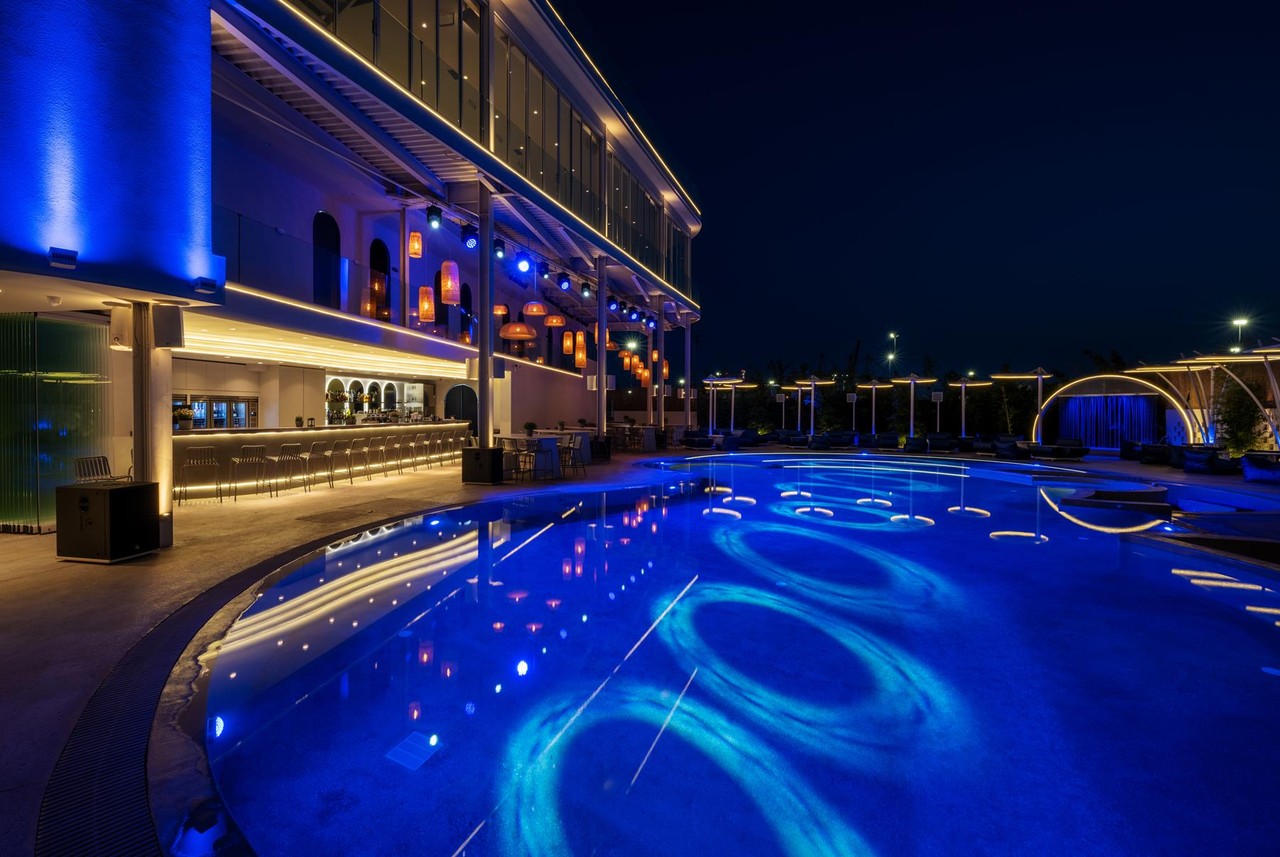 Imperial Port Convention Club poolside area at night